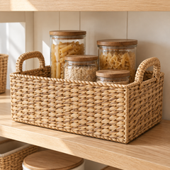 Bondi seagrass shelf basket holding pantry jars on an oak shelf